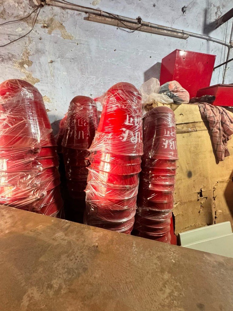 Same dome housings after high-gloss red powder coating batch